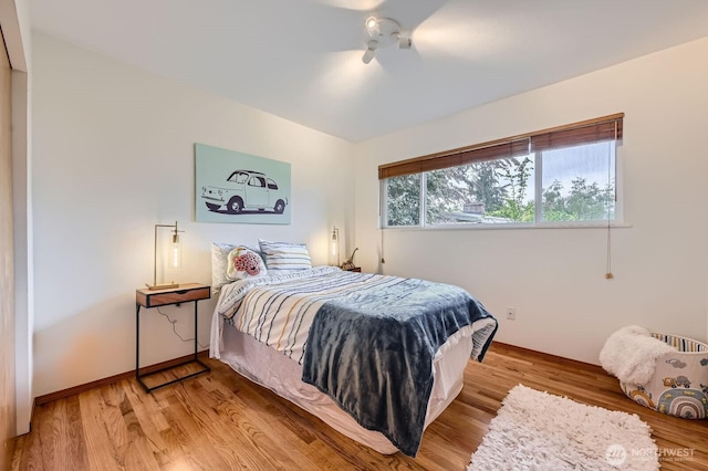 2545 NE 204th St, Shoreline, WA 98155 - bedroom featuring light wood finished floors, ceiling fan, and baseboards