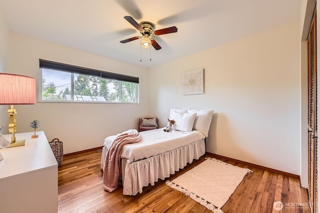 2545 NE 204th St, Shoreline, WA 98155 - bedroom with light wood-style floors, baseboards, and a ceiling fan