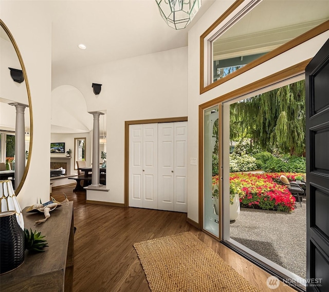 1118 2nd Ave S, Edmonds, WA 98020 - entryway with decorative columns, wood finished floors, baseboards, a high ceiling, and recessed lighting