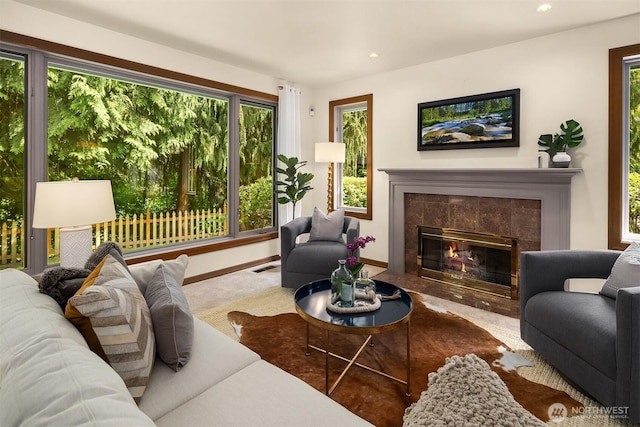 1118 2nd Ave S, Edmonds, WA 98020 - living area with a tiled fireplace, carpet, recessed lighting, and baseboards