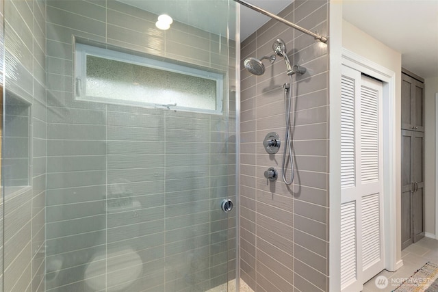 full bath featuring tiled shower