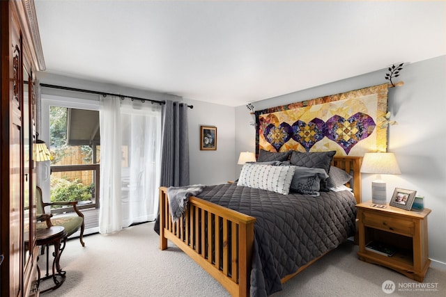 bedroom featuring light colored carpet and access to outside