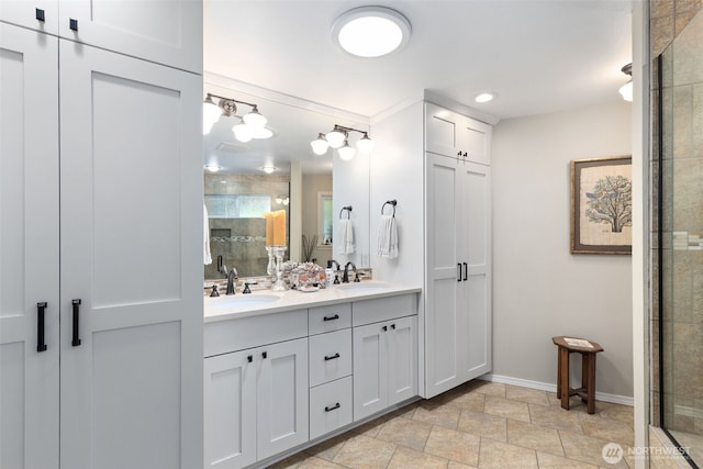 full bath with a stall shower, baseboards, double vanity, stone finish floors, and recessed lighting