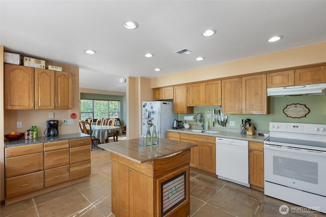20501 Delta Rd NW, Soap Lake, WA 98851 - kitchen featuring white appliances, under cabinet range hood, a sink, light tile patterned flooring, and recessed lighting