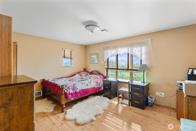 20501 Delta Rd NW, Soap Lake, WA 98851 - bedroom with multiple windows, light wood finished floors, and baseboards
