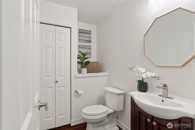 18808 19th Dr SE, Bothell, WA 98012 - bathroom featuring a closet, toilet, vanity, and wood finished floors