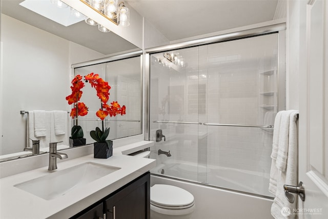 18808 19th Dr SE, Bothell, WA 98012 - full bathroom with vanity, shower / bath combination with glass door, toilet, and a skylight