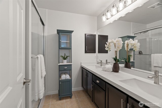 18808 19th Dr SE, Bothell, WA 98012 - bathroom featuring a shower stall, tile patterned flooring, double vanity, and baseboards