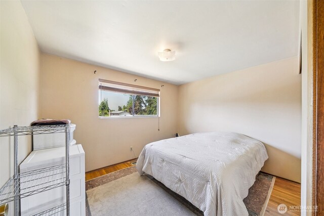 bedroom with wood finished floors