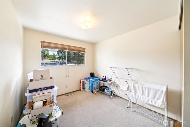 bedroom featuring carpet and baseboards
