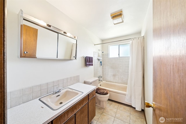 bathroom featuring toilet, shower / tub combo with curtain, tile patterned flooring, vanity, and backsplash