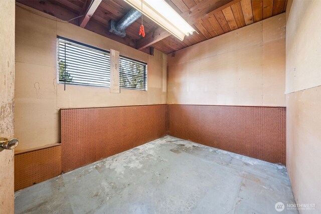 spare room featuring concrete flooring