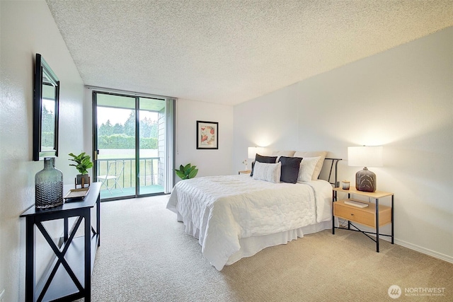 bedroom with access to outside, light carpet, a textured ceiling, a wall of windows, and baseboards