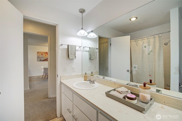 full bath with vanity and curtained shower