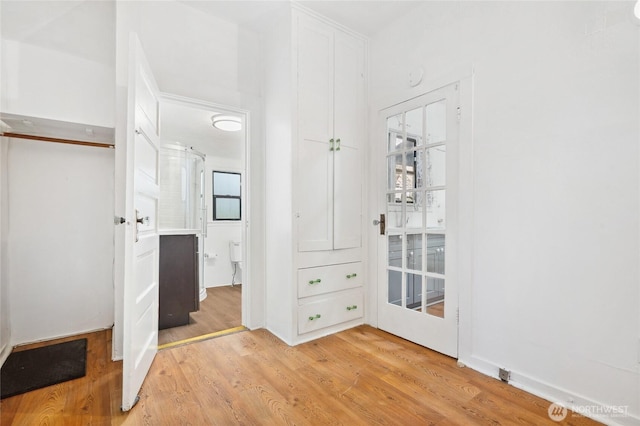 unfurnished bedroom featuring light wood-style floors