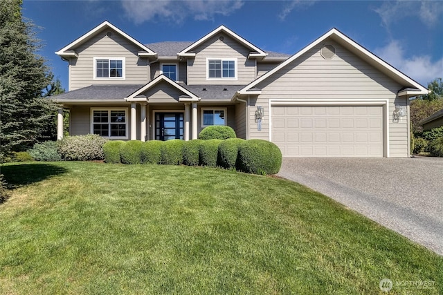 view of front of house with concrete driveway, a garage, a front lawn, and a shingled roof