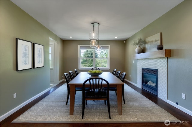 1224 Studebaker Pl, Walla Walla, WA 99362 - dining room featuring dark wood finished floors and a fireplace