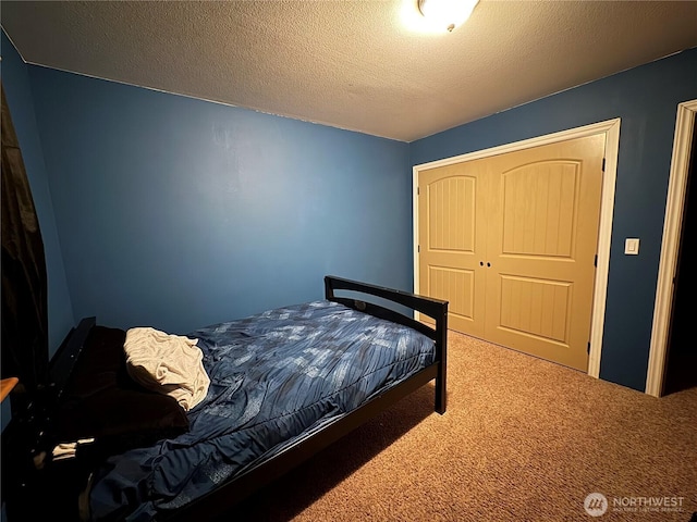 615 George Taylor Rd, Silverlake, WA 98645 - carpeted bedroom featuring a closet and a textured ceiling