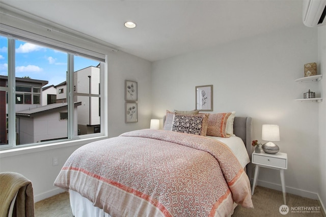 bedroom with baseboards, a wall unit AC, carpet flooring, and recessed lighting