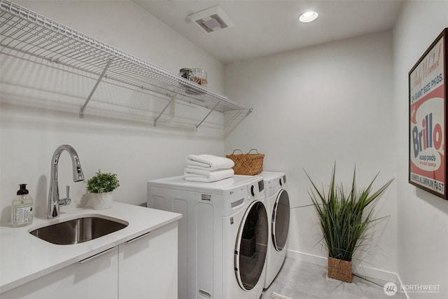 laundry room featuring separate washer and dryer, recessed lighting, and baseboards