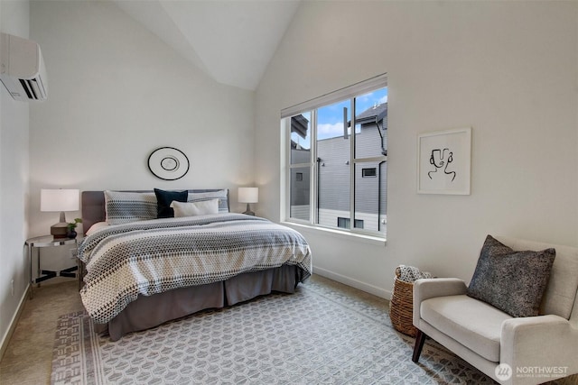 carpeted bedroom with baseboards, a wall mounted air conditioner, and vaulted ceiling