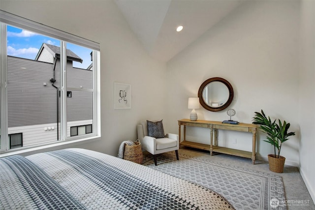 bedroom featuring vaulted ceiling, baseboards, and carpet