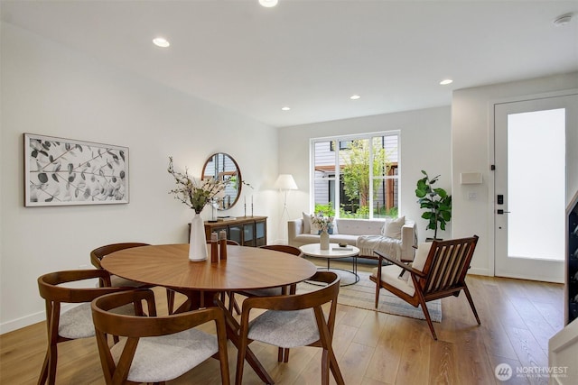 dining area with light wood-style flooring, recessed lighting, and baseboards