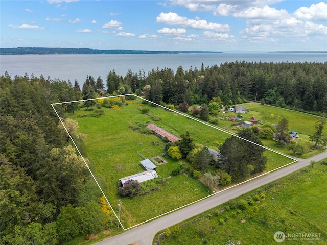 660 Schwartz Rd, Nordland, WA 98358 - aerial view of property and surrounding area with property boundaries highlighted, a large body of water, and a heavily wooded area
