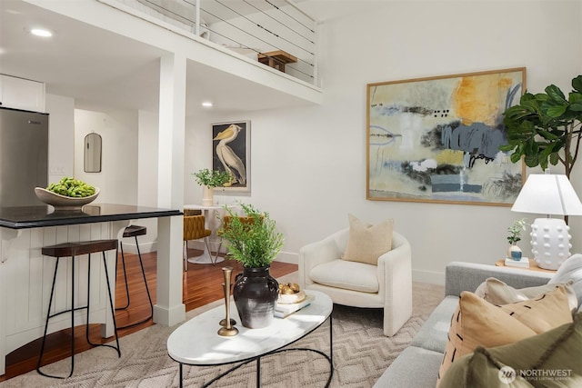 living room with baseboards and recessed lighting