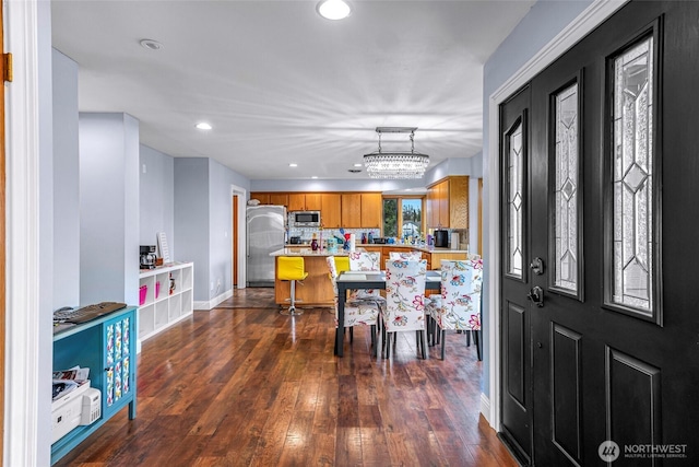 801 Bender Pl, Lynden, WA 98264 - kitchen with appliances with stainless steel finishes, brown cabinetry, light countertops, recessed lighting, and dark wood-style flooring