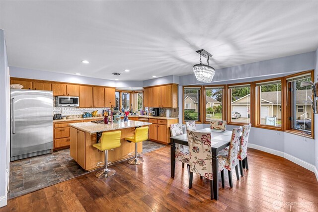 801 Bender Pl, Lynden, WA 98264 - dining area with baseboards, dark wood-style floors, a chandelier, and recessed lighting