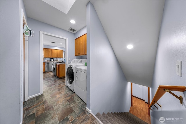 801 Bender Pl, Lynden, WA 98264 - laundry area with washing machine and clothes dryer, cabinet space, stone finish floors, baseboards, and recessed lighting