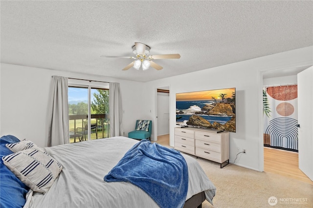 9320 96th St NE, Arlington, WA 98223 - bedroom with access to outside, light carpet, a textured ceiling, and ceiling fan