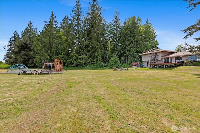 9320 96th St NE, Arlington, WA 98223 - view of green lawn featuring a deck