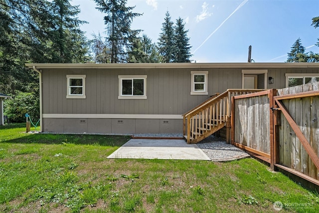 back of property with a patio