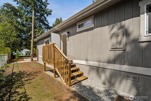 view of home's exterior featuring fence and crawl space