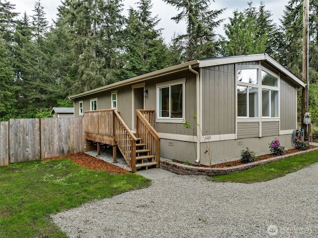 view of front of property with crawl space and a deck