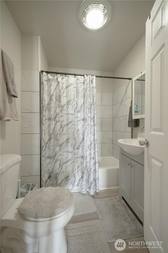 213 N Division, Elma, WA 98541 - bathroom with toilet, vanity, and shower / bath combination with curtain