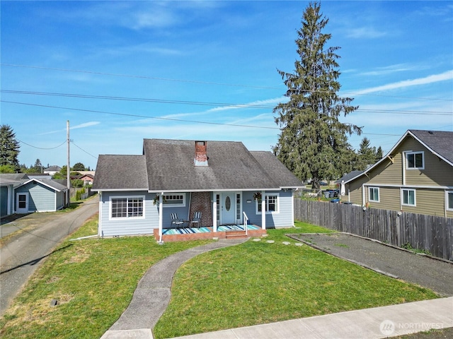 213 N Division, Elma, WA 98541 - view of front of home featuring covered porch, a chimney, and roof with shingles
