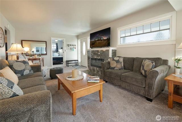 213 N Division, Elma, WA 98541 - carpeted living room featuring healthy amount of natural light and a tiled fireplace