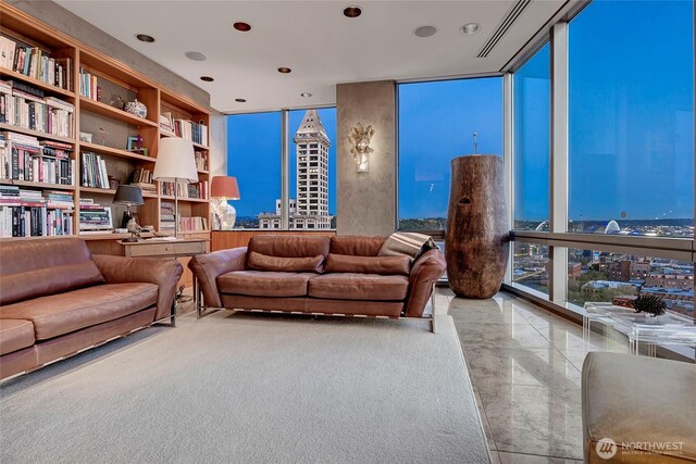 715 2nd Ave Unit 1801, Seattle, WA 98104 - living room featuring a wall of windows and recessed lighting