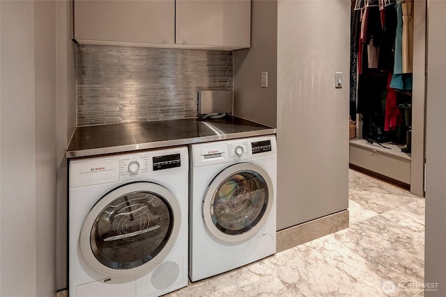 715 2nd Ave Unit 1801, Seattle, WA 98104 - clothes washing area with cabinet space and washer and clothes dryer