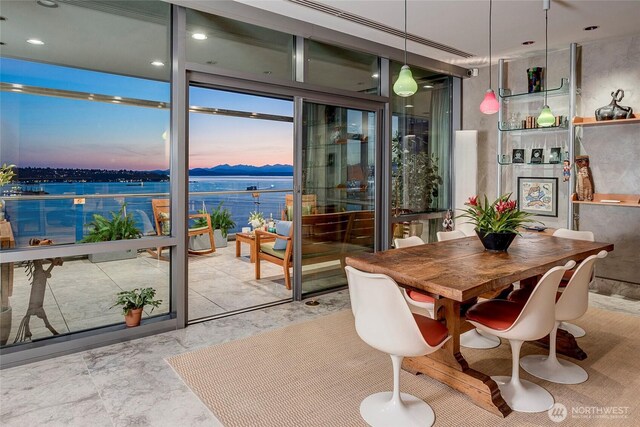 715 2nd Ave Unit 1801, Seattle, WA 98104 - dining area featuring floor to ceiling windows and a water view