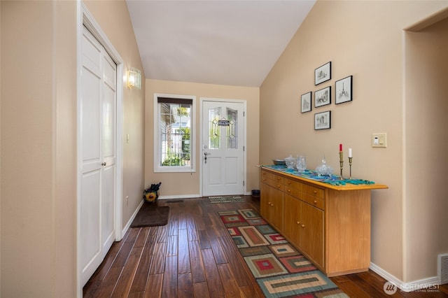 987 NW Camano Dr, Camano Island, WA 98282 - foyer entrance featuring lofted ceiling, dark wood-style floors, and baseboards