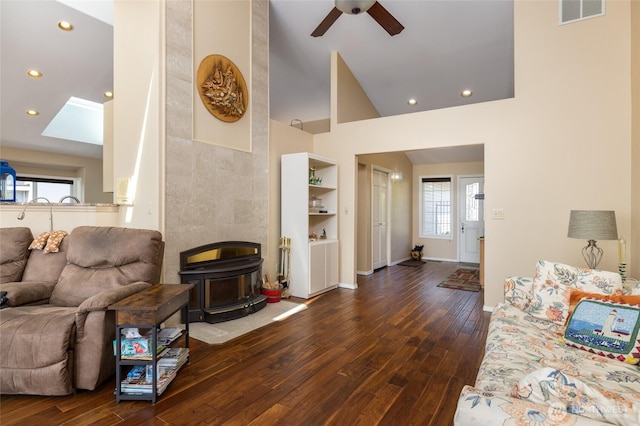987 NW Camano Dr, Camano Island, WA 98282 - living area with a wood stove, dark wood-style floors, a ceiling fan, high vaulted ceiling, and recessed lighting