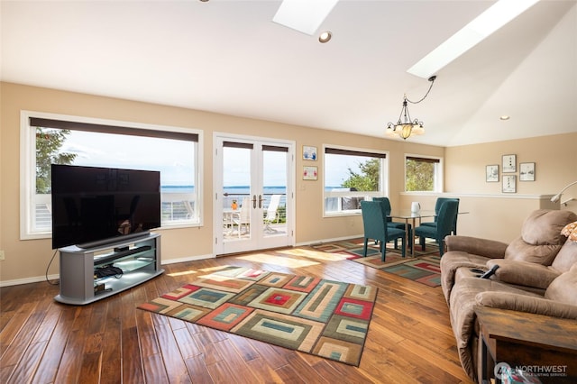 987 NW Camano Dr, Camano Island, WA 98282 - living room with a skylight, wood-type flooring, and baseboards