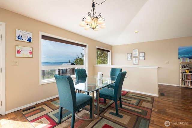 987 NW Camano Dr, Camano Island, WA 98282 - dining area featuring a chandelier, wood finished floors, baseboards, and recessed lighting