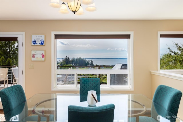 987 NW Camano Dr, Camano Island, WA 98282 - dining area featuring a chandelier and plenty of natural light