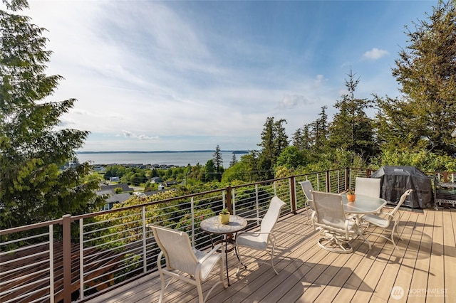 987 NW Camano Dr, Camano Island, WA 98282 - deck featuring outdoor dining space, area for grilling, and a water view