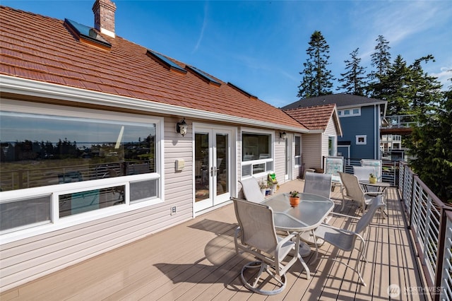987 NW Camano Dr, Camano Island, WA 98282 - wooden terrace featuring french doors and outdoor dining area